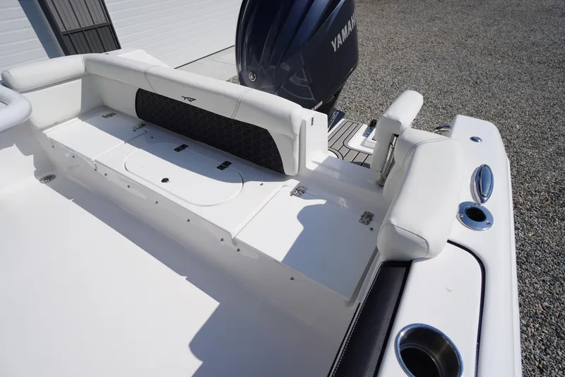 Slide: The Image of 2026 Tidewater 220 LXF boat interior with Yamaha engine, featuring white seating and storage compartments. - 43