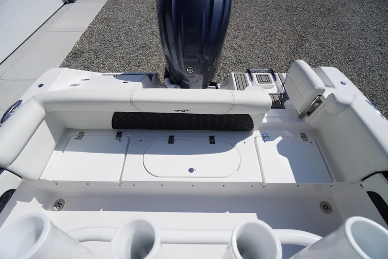 Slide: The Image of 2026 Tidewater 220 LXF boat interior with seating and storage compartments. - 44