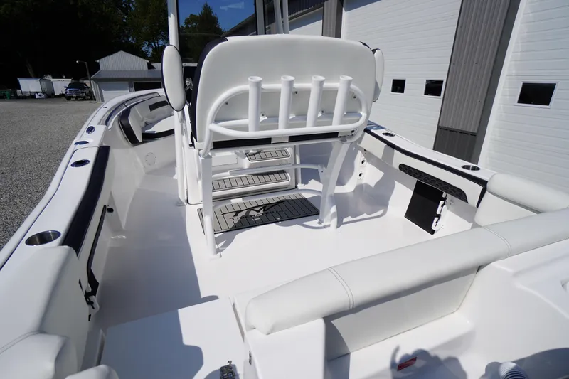 Slide: The Image of 2026 Tidewater 220 LXF boat interior with seating and rod holders. - 49