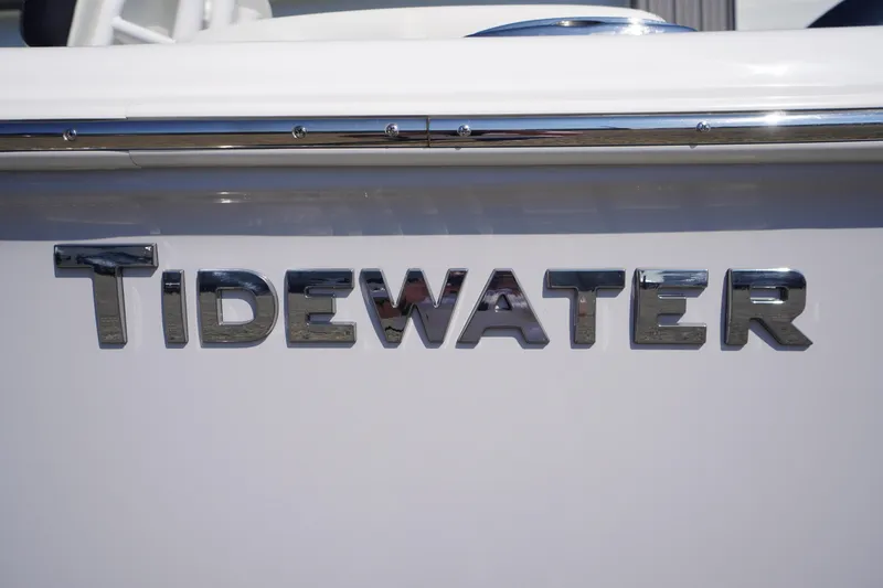 Slide: The Image of Chrome "Tidewater" logo on 2026 Tidewater 220 LXF boat exterior. - 5