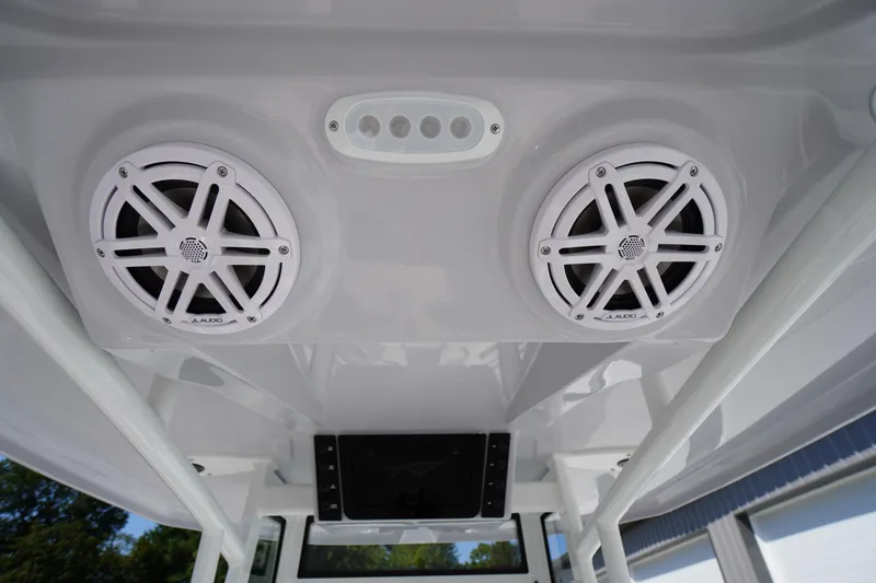 Slide: The Image of 2026 Tidewater 220 LXF boat speakers and control panel on the ceiling. - 52
