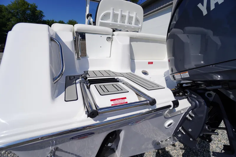 Slide: The Image of 2026 Tidewater 220 LXF boat stern with swim platform and ladder. - 56