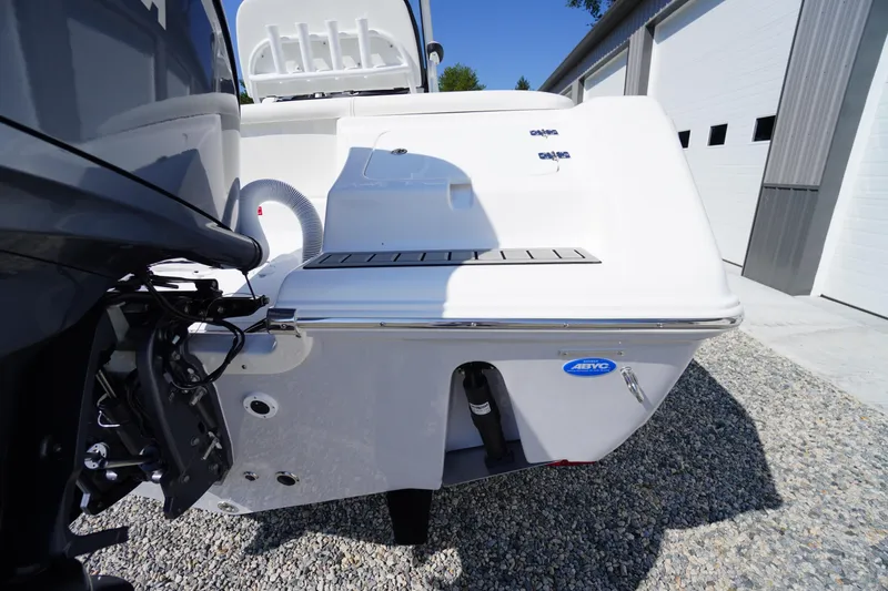 Slide: The Image of 2026 Tidewater 220 LXF boat stern view, showcasing engine and sleek design. - 59