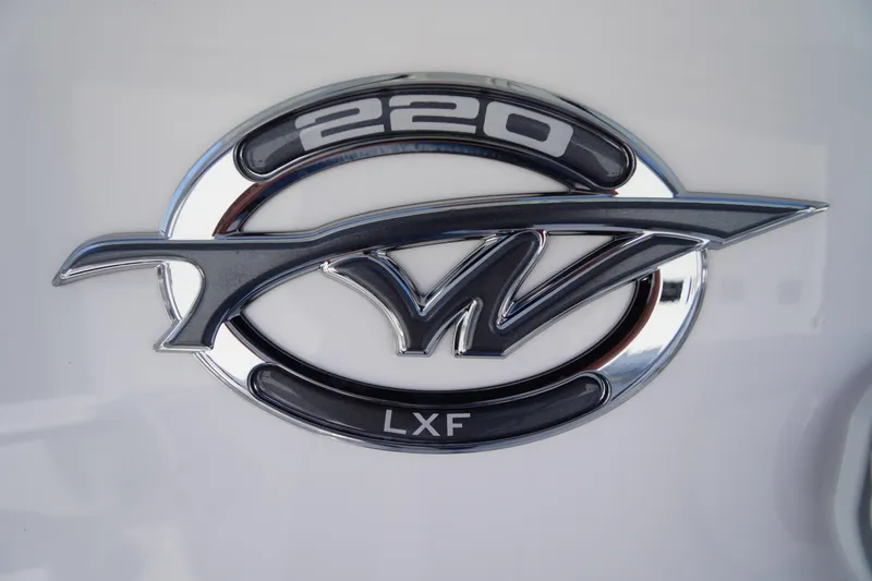 Slide: The Image of Tidewater 220 LXF 2026 logo emblem on a sleek white surface. - 6
