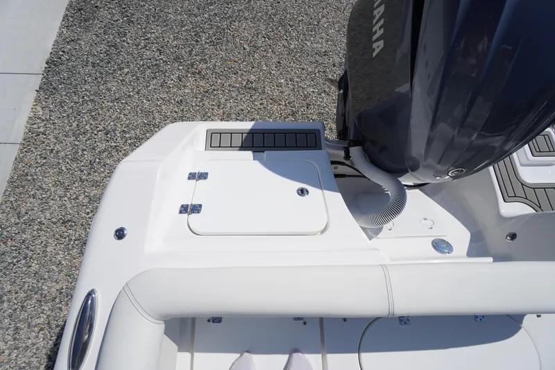Slide: The Image of 2026 Tidewater 220 LXF boat with Yamaha engine, rear deck view. - 62