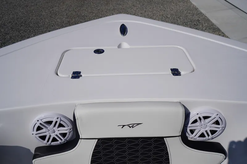 Slide: The Image of 2026 Tidewater 220 LXF boat interior with speakers and storage compartment. - 7