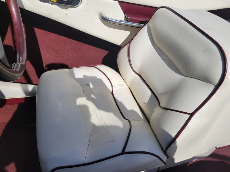 Slide: The Image of White and maroon boat seat in a 1991 Maxum 2100 XC. - 11
