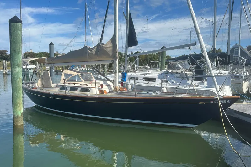 The Image of Sailboat docked in marina, Morris M36, 2006 model, under clear blue sky. - 0