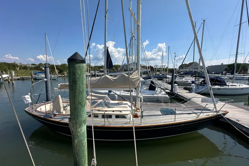 Slide: The Image of Sailboat docked in marina, Morris M36, 2006 model, under clear blue sky. - 10