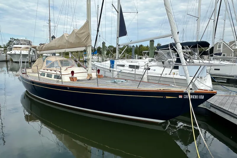 Slide: The Image of Sailboat Morris M36, 2006 model, docked in a marina with other boats. - 2
