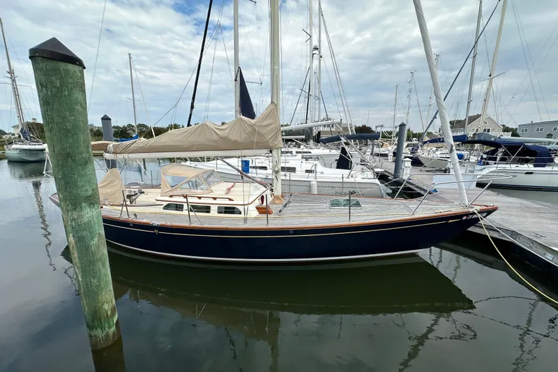 Slide: The Image of Sailboat docked in marina, 2006 Morris M36, with blue hull and tan sail cover. - 29