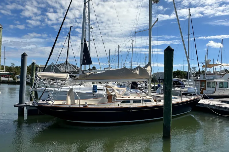 Slide: The Image of Sailboat docked in marina, Morris M36, 2006 model, under a clear blue sky. - 4