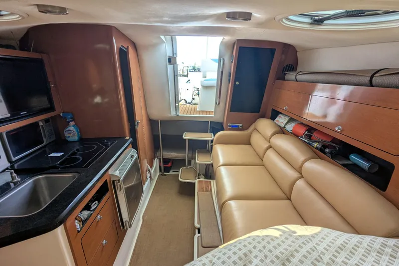 Slide: The Image of Interior of a 2008 Century 3200 Offshore boat with kitchen and seating area. - 13