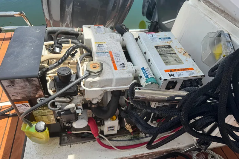 Slide: The Image of Engine compartment of a 2008 Century 3200 Offshore boat, featuring Kohler power system. - 19