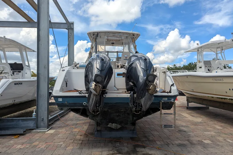 Slide: The Image of 2008 Century 3200 Offshore boat with dual outboard motors on a sunny day. - 3