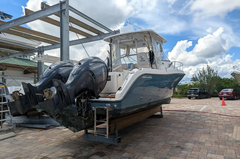 Slide: The Image of 2008 Century 3200 Offshore boat with dual Yamaha engines on a lift. - 4