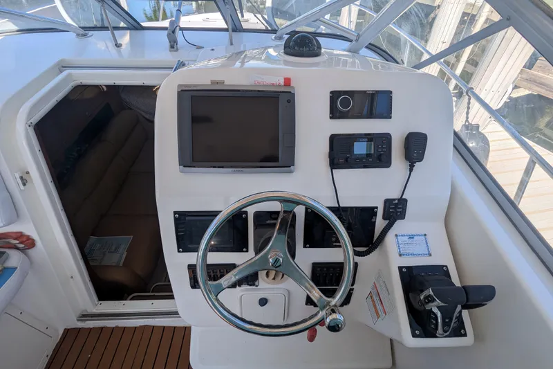 Slide: The Image of Helm of 2008 Century 3200 Offshore boat with navigation equipment and steering wheel. - 7