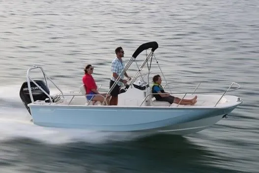 Slide: The Image of Manufacturer Provided Image: 2019 Boston Whaler 170 Montauk boat cruising on water with three passengers. - 4