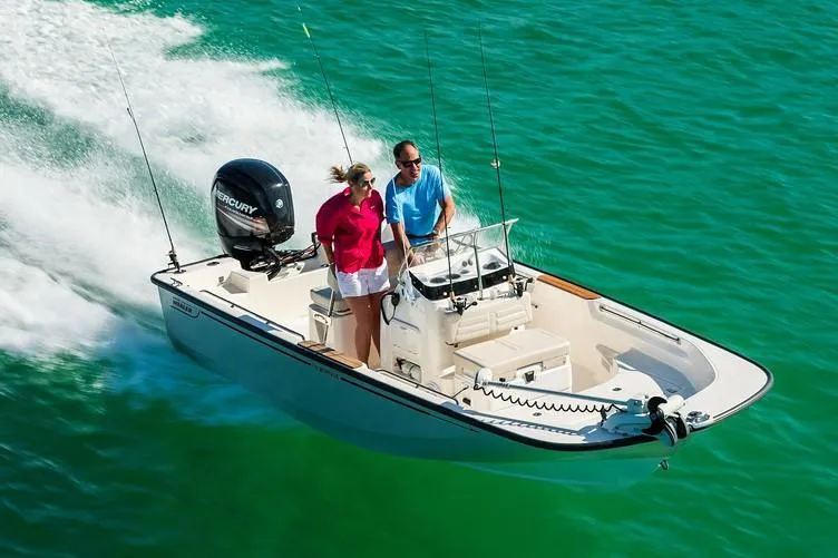 Slide: The Image of Manufacturer Provided Image: 2019 Boston Whaler 170 Montauk boat cruising on clear turquoise water. - 6