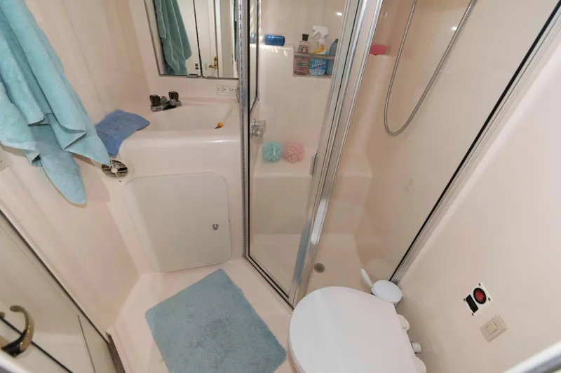 Slide: The Image of Bathroom interior of 2000 Silverton 37 Convertible yacht with shower and sink. - 22