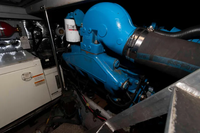 Slide: The Image of Engine room of 2000 Silverton 37 Convertible with blue engine and Kohler generator. - 26