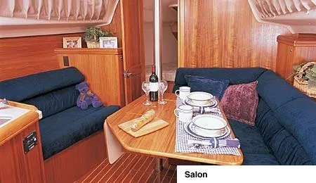 Slide: The Image of Aerial view of a 2002 Hunter 306 sailboat in a boatyard, next to a parked car. - 3