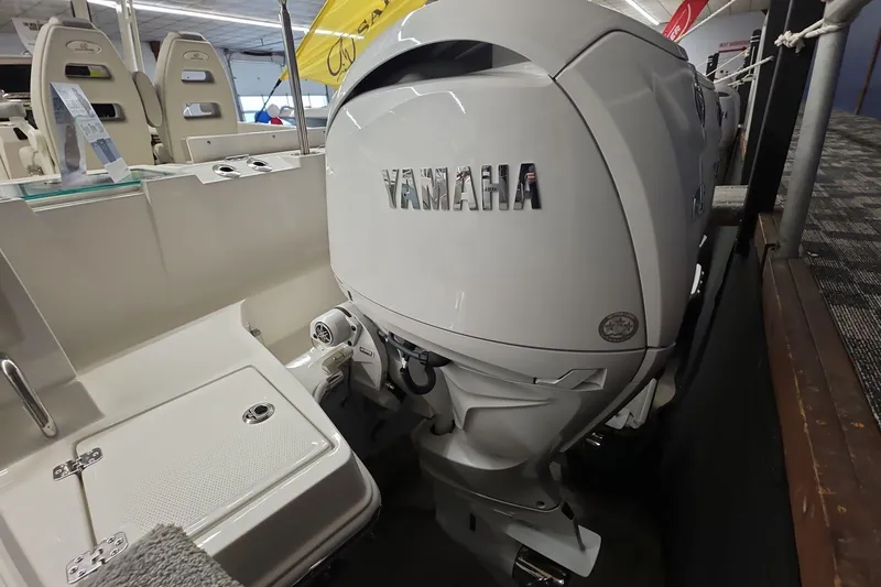 Slide: The Image of 2026 Sailfish 252 CC boat with Yamaha outboard motor in showroom. - 12