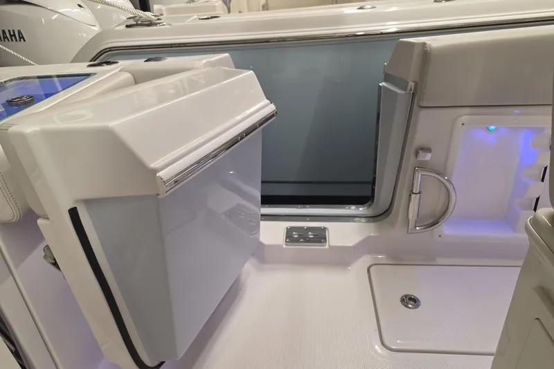 Slide: The Image of 2026 Sailfish 252 CC boat interior with storage compartments and sleek design. - 6