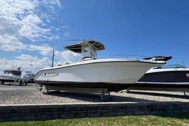Slide: The Image of 2004 Century 2600 CC boat on display under a partly cloudy sky. - 0