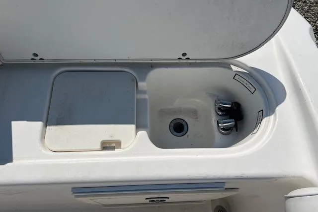 Slide: The Image of Open storage compartment on a 2004 Century 2600 CC boat. - 15