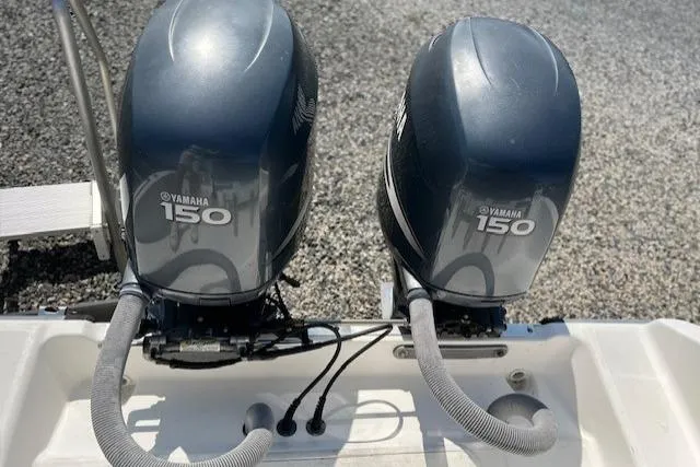 Slide: The Image of Twin Yamaha 150 outboard motors on a 2004 Century 2600 CC boat. - 5