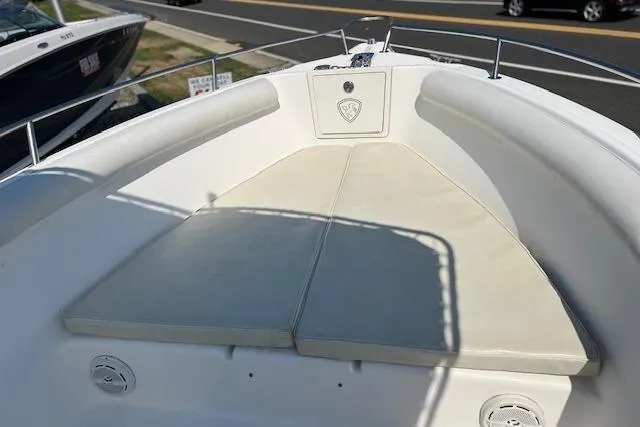 Slide: The Image of 2004 Century 2600 CC boat bow with cushioned seating and railing. - 7