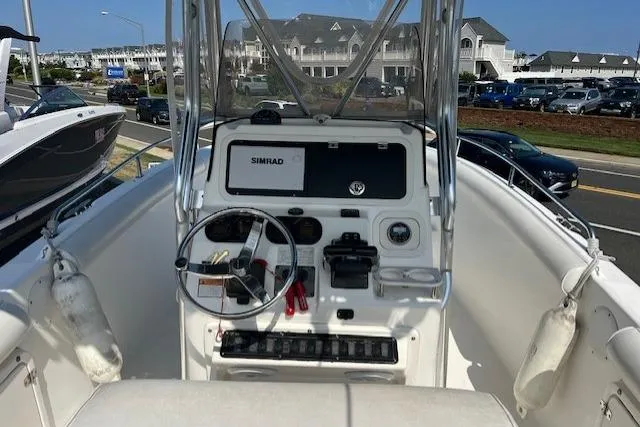 Slide: The Image of 2004 Century 2600 CC boat console with steering wheel and Simrad display. - 8