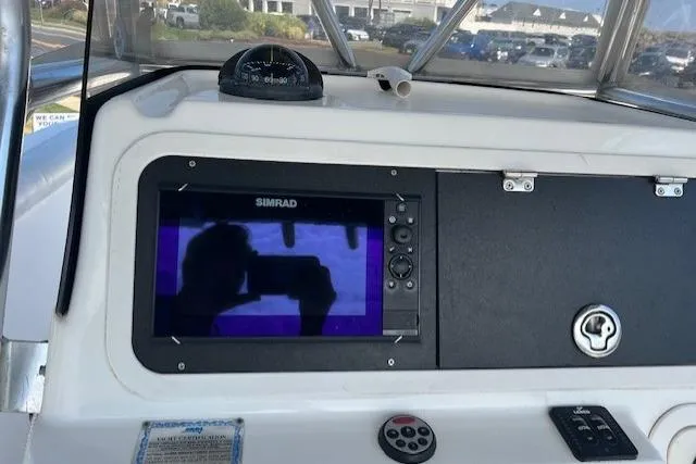 Slide: The Image of Century 2600 CC 2004 boat dashboard with Simrad display and compass. - 9