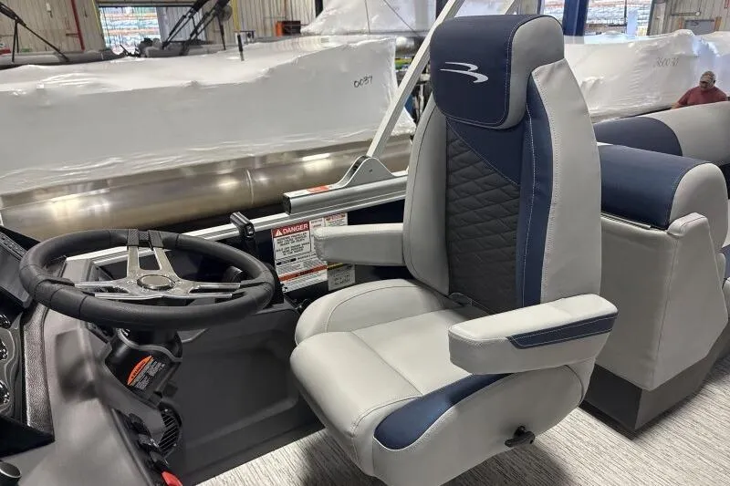 Slide: The Image of 2026 Bennington 23 SSRSF pontoon boat in a factory setting. - 10