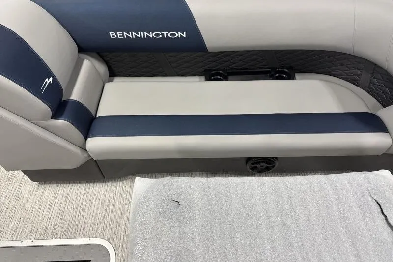 Slide: The Image of 2026 Bennington 23 SSRSF boat interior with blue and gray seating. - 17
