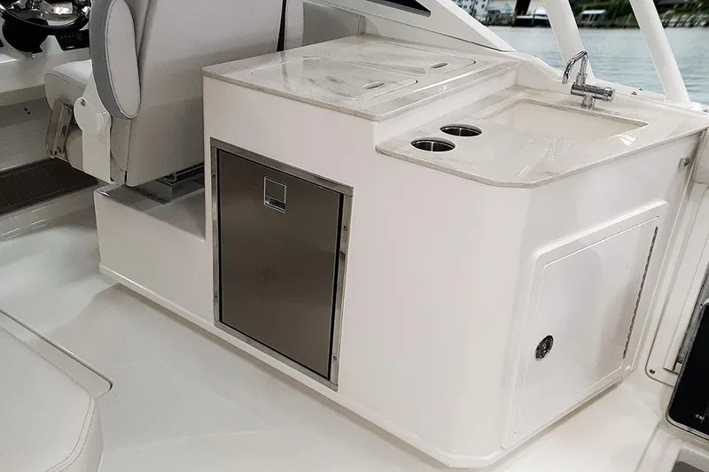 Slide: The Image of 2026 Sailfish 276 DC boat interior with foldable seat and cup holders. - 21