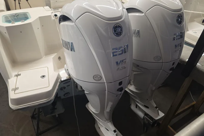 Slide: The Image of Twin Yamaha 250 V6 outboard engines on a 2026 Sailfish 276 DC boat. - 28
