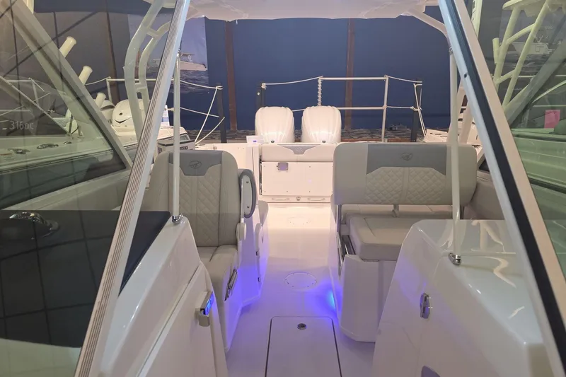 Slide: The Image of 2026 Sailfish 276 DC boat interior with seating and dual engines. - 29