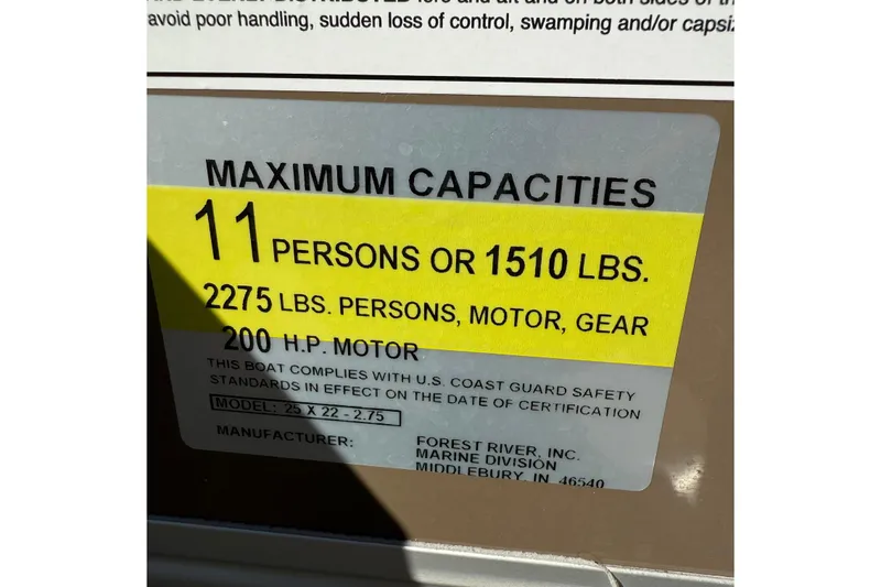 Slide: The Image of 2025 Berkshire 22CL CTS pontoon boat interior with beige seating and steering console. - 11