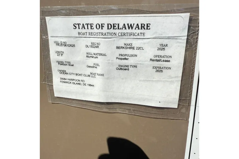 Slide: The Image of 2025 Berkshire 22CL CTS boat helm with beige captain's chair and steering wheel. - 12