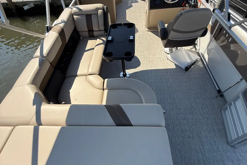 Slide: The Image of 2025 Berkshire 22CL CTS pontoon boat on trailer, covered and parked outdoors. - 5