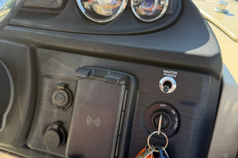 Slide: The Image of 2025 Berkshire 22CL CTS pontoon boat interior with beige seating and cup holders. - 9