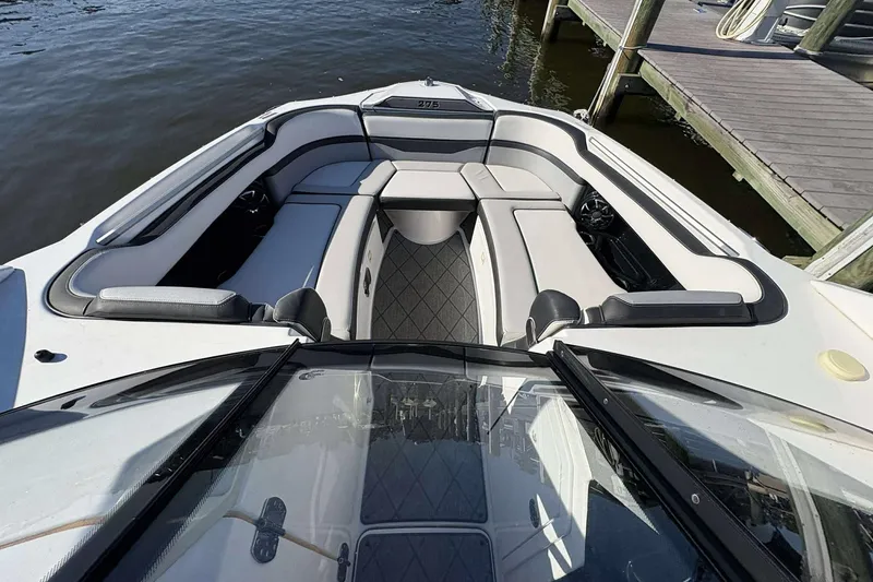 Slide: The Image of 2019 Yamaha 275 SE boat interior with spacious seating and sleek design. - 13