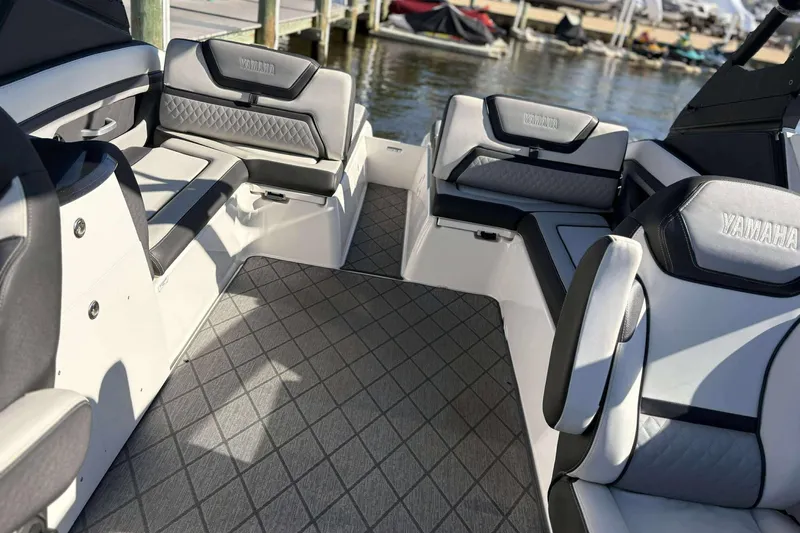 Slide: The Image of 2019 Yamaha 275 SE boat interior with luxurious seating and modern design. - 21