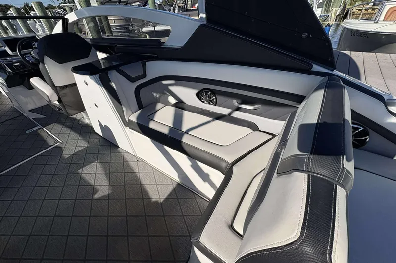 Slide: The Image of 2019 Yamaha 275 SE boat interior with sleek seating and modern design. - 8