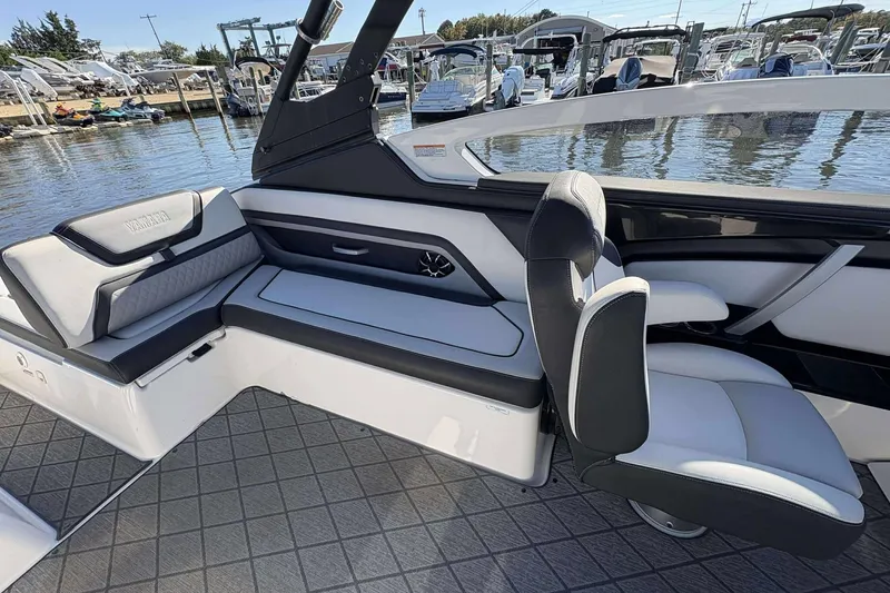 Slide: The Image of Interior of a 2019 Yamaha 275 SE boat, featuring sleek seating and modern design. - 9
