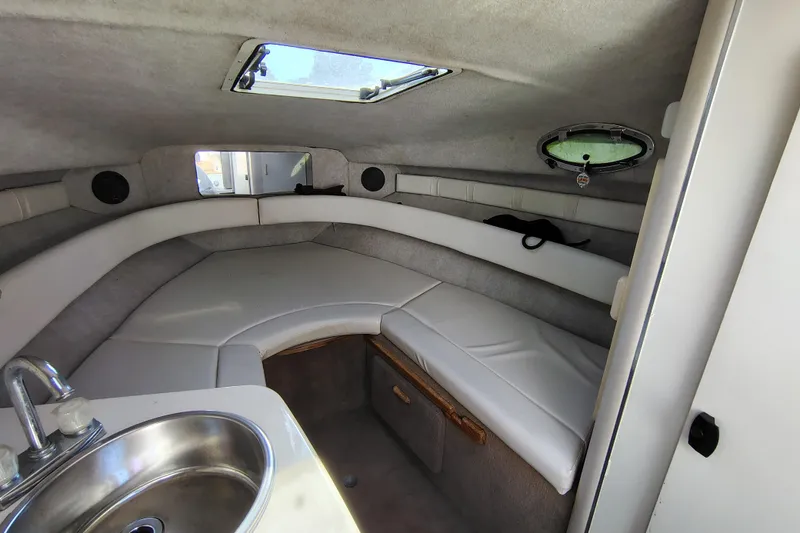 Slide: The Image of Interior cabin of 1995 Sea Ray 250 Sundancer with seating and sink. - 21