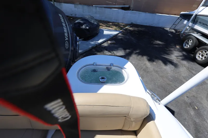 Slide: The Image of 2019 NauticStar 2302 Legacy boat with Yamaha engine and livewell. - 16