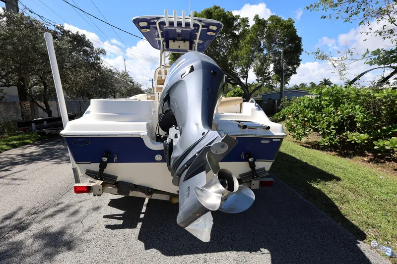 Slide: The Image of 2019 NauticStar 2302 Legacy boat with outboard motor on trailer. - 5